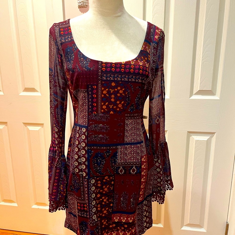 Never worn, long bell sleeve